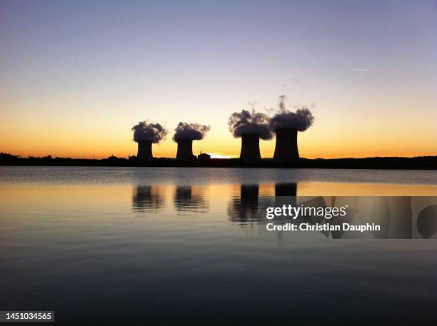 cattenom nuclear power station at dusk. - cattenom stock pictures, royalty-free photos & images