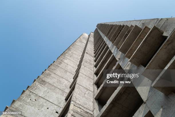 concrete building exterior - ruffled stock-fotos und bilder