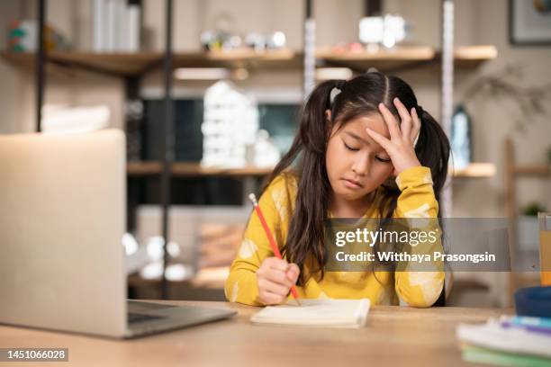 focused girl concerned about difficult online task studying - difficult task stock pictures, royalty-free photos & images