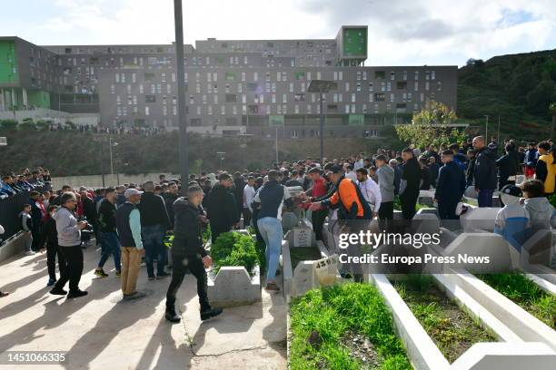 Dozens of people attend the burial of the eight-year-old boy, in the Muslim cemetery Sidi Embarek, on 21 December, 2022 in Ceuta, Spain. The body of...