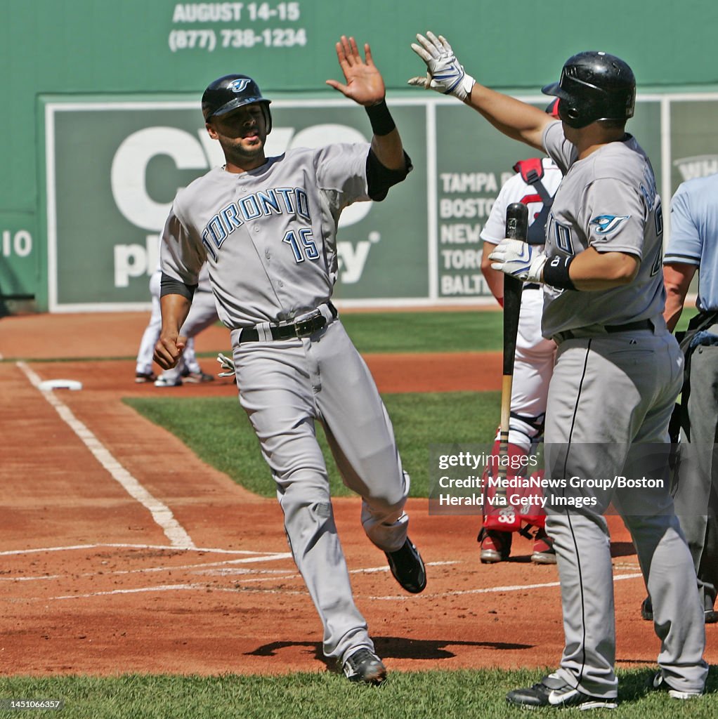 Toronto Rios Toronto Blue Jays' Alex Rios got a high five from Rod Barajas after ...