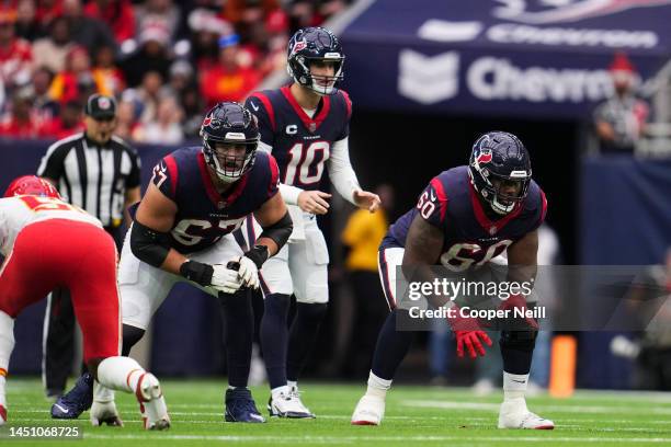 Charlie Heck of the Houston Texans and A.J. Cann get set against the Kansas City Chiefs at NRG Stadium on December 18, 2022 in Houston, Texas.