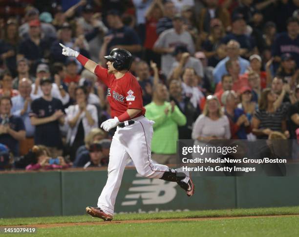 Christian Vazquez points as he heads home on his solo home run in the fifth inning of the Red Sox vs. Yankees MLB game at Fenway Park. Friday, August...