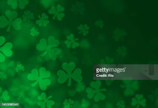 four-leafed clover shamrock st. patrick's day textured green background - st patricks day stock illustrations
