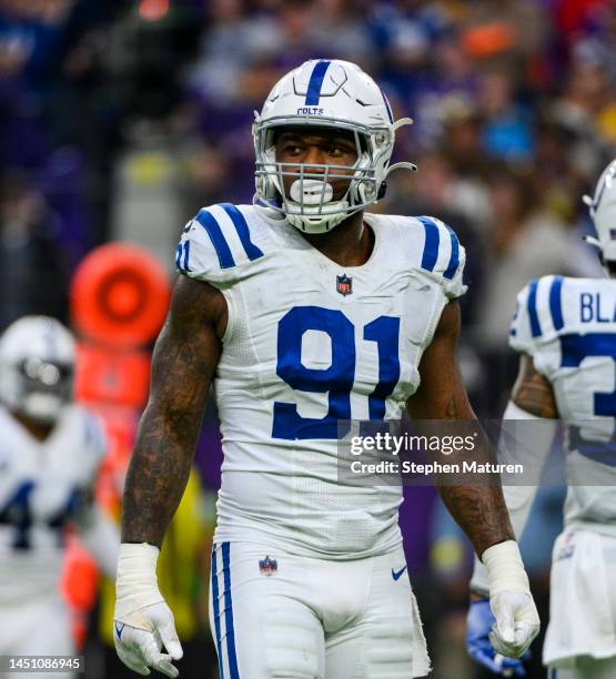 Yannick Ngakoue of the Indianapolis Colts stands between plays in the fourth quarter of the game against the Minnesota Vikings at U.S. Bank Stadium...