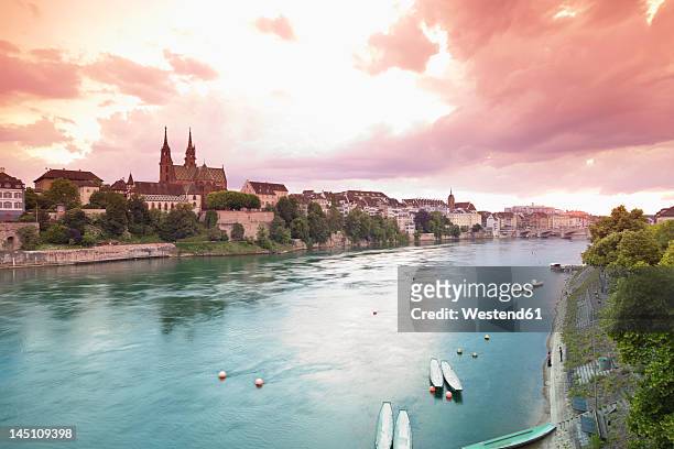 switzerland, basel, view of basel munster and old town at sunset - bale stock-fotos und bilder