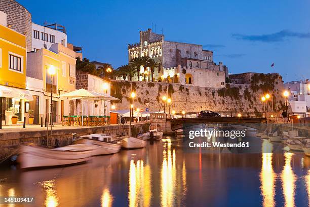spain,menorca, mahon, view of city hall at dusk - menorca stockfoto's en -beelden
