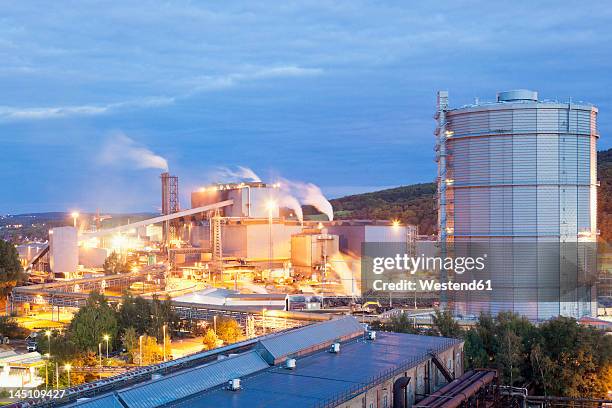 germany, voelklingen, view of industrial building at dusk - saarland imagens e fotografias de stock