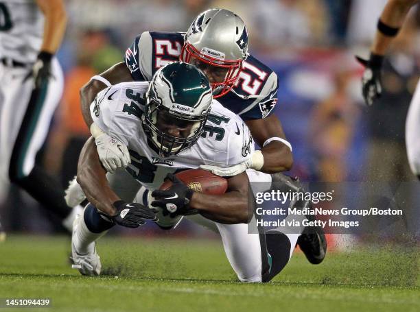 Foxboro, MA - New England Patriots defensive back Ras-I Dowling takes down Philadelphia Eagles running back Bryce Brown in a preseason game at...