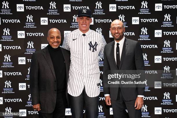 Former New York Yankees captains Willie Randolph and Derek Jeter pose for a photo with Aaron Judge of the New York Yankees after a press conference...