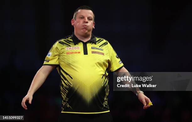 Dave Chisnall of England celebrates the win during his Second Round match against Andrew Gilding of England during Day Seven of The Cazoo World Darts...