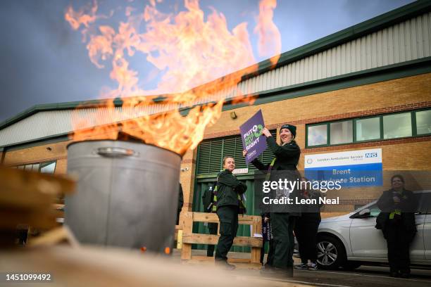 Ambulance workers and supporters gather outside Brent Ambulance Station during a strike over pay and conditions on December 21, 2022 in London,...