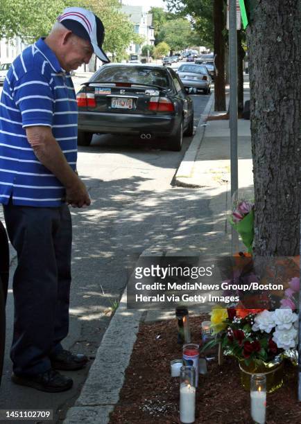Ernest Hewitt stands at the roadside memorial of his friend David Burgess after the Thursday night death of his friend after he was hit by a Chelsea...