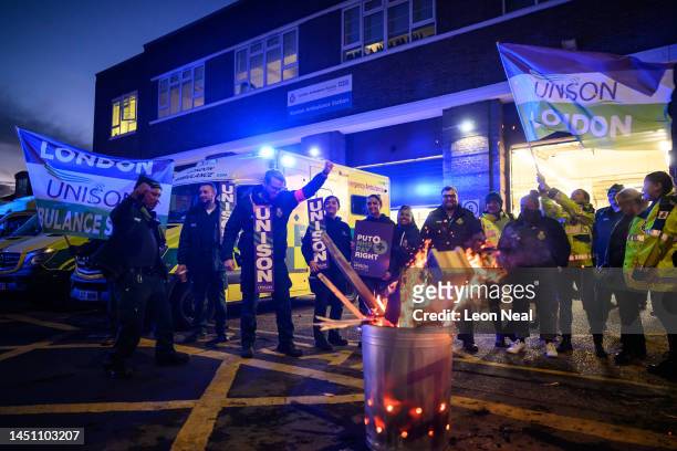 Ambulance workers and supporters gather outside Kenton Ambulance Station during a strike over pay and conditions on December 21, 2022 in London,...