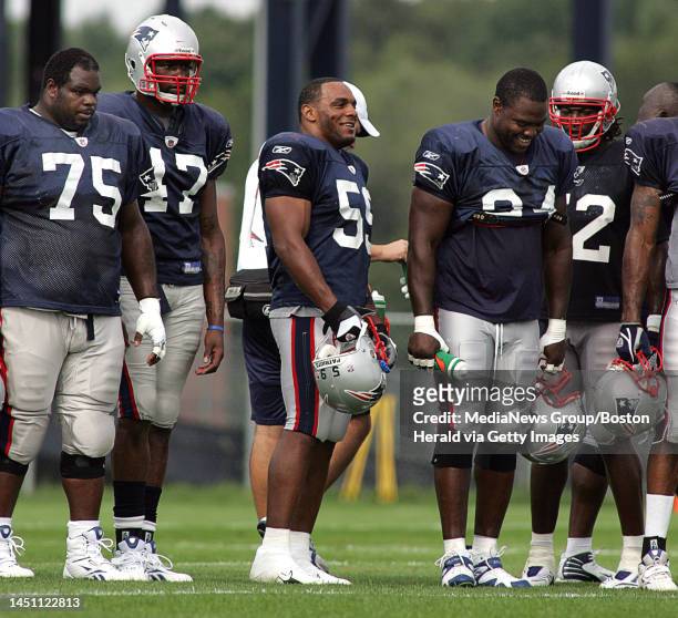 From left, Vince Wilfork Vince Redd Victor Hobson and Benjamin Watson look on as their team practices during the New England Patriots camp. August...