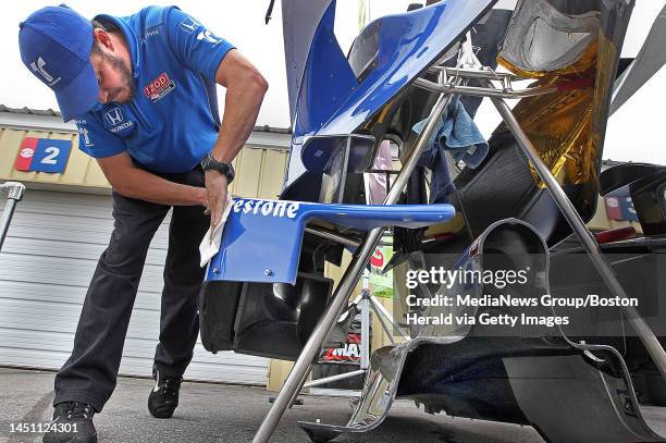 Loudon, NH)Oren Trower, front end mechanic for Oriol Servia's car, polishes the side pods before the race.IZOD IndyCar Series racing the...