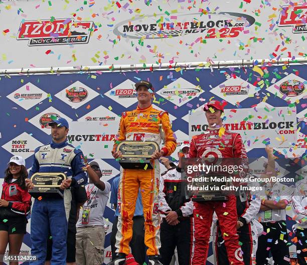 Loudon, NH)Confetti rains down on Second place finisher Oriol Servia , winner Ryan Hunter-Reay and 3rd place finisher Scott Dixon in Victory Lane....