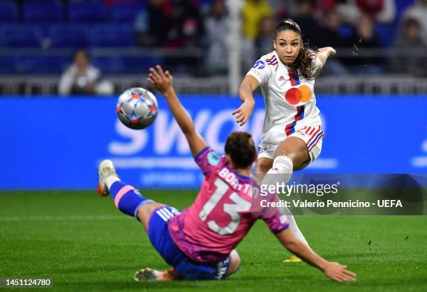 Delphine Cascarino of Olympique Lyonnais takes a shot whilst under pressure from Lisa Boattin of Juventus during the UEFA Women's Champions League...