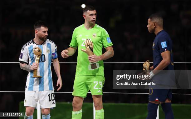 Lionel Messi of Argentina with the award of 'best player of the tournament', Argentina goalkeeper Emiliano Martinez aka Damian Martinez 'best...