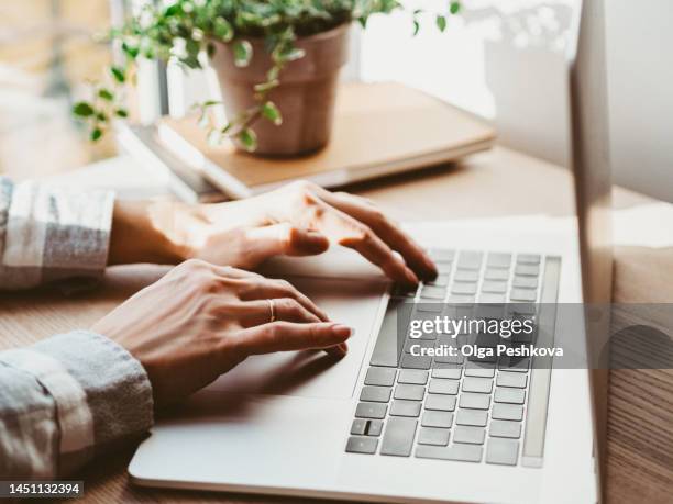 woman working at home office hand on keyboard close up - desktop pc ストックフォトと画像