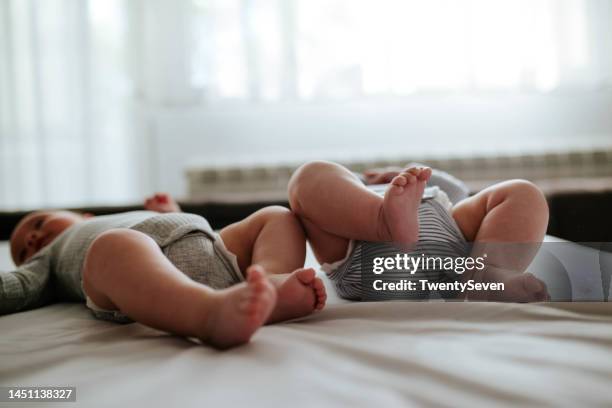feet of newborn babies - twin stock pictures, royalty-free photos & images