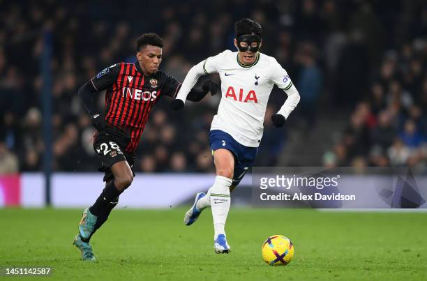 Son Heung-Min of Tottenham Hotspur breaks past Hicham Boudaoui of Nice during the Friendly match between Tottenham Hotpsur and OGC Nice at Tottenham...