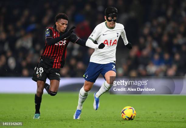 Son Heung-Min of Tottenham Hotspur breaks past Hicham Boudaoui of Nice during the Friendly match between Tottenham Hotpsur and OGC Nice at Tottenham...