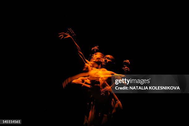 This multiple exposure image shows Wang Di performs choreography by Wang Di during the Gala Stars of Benois de la Danse in the main stage of the...