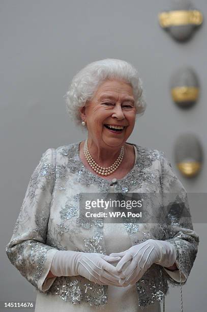 Queen Elizabeth II laughs as she attends a special 'Celebration of the Arts' event at the Royal Academy of Arts on May 23, 2012 in London, England.