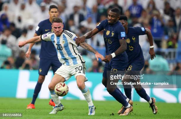 Alexis Mac Allister of Argentina vies with Marcus Thuram of France during the FIFA World Cup Qatar 2022 Final match between Argentina and France at...
