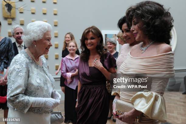 Queen Elizabeth II meets actress Joan Collins , singer Shirley Bassey and actress Kate O'Mara at a special 'Celebration of the Arts' event at the...
