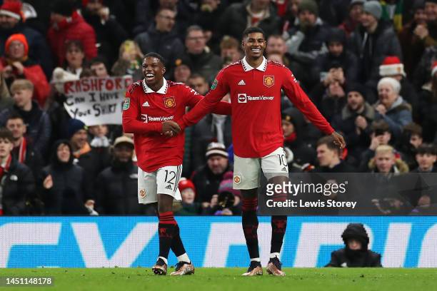 Marcus Rashford of Manchester United celebrates scoring their side's second goal with teammate Tyrell Malacia during the Carabao Cup Fourth Round...
