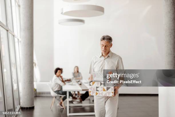 office worker with carton box is fired - possession stock pictures, royalty-free photos & images