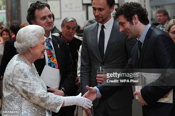 Queen Elizabeth II meets actor Michael Sheen at a special 'Celebration of the Arts' event at the Royal Academy of Arts on May 23, 2012 in London,...