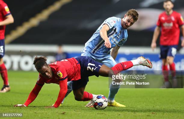 Brandon Thomas-Asante of West Bromwich Albion contests the ball with Ben Sheaf of Coventry City during the Sky Bet Championship between Coventry City...