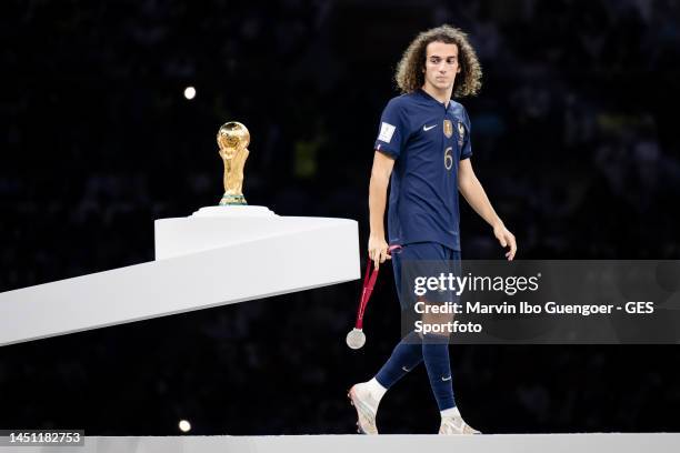 Matteo Guendouzi of France looks dejected passing the World Cup trophy after the FIFA World Cup Qatar 2022 Final match between Argentina and France...