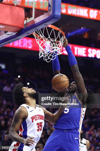 Montrezl Harrell of the Philadelphia 76ers dunks over Marvin Bagley III of the Detroit Pistons during the first quarter at Wells Fargo Center on...
