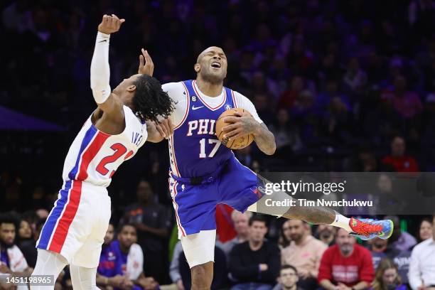 Tucker of the Philadelphia 76ers and Jaden Ivey of the Detroit Pistons collide during the second quarter at Wells Fargo Center on December 21, 2022...