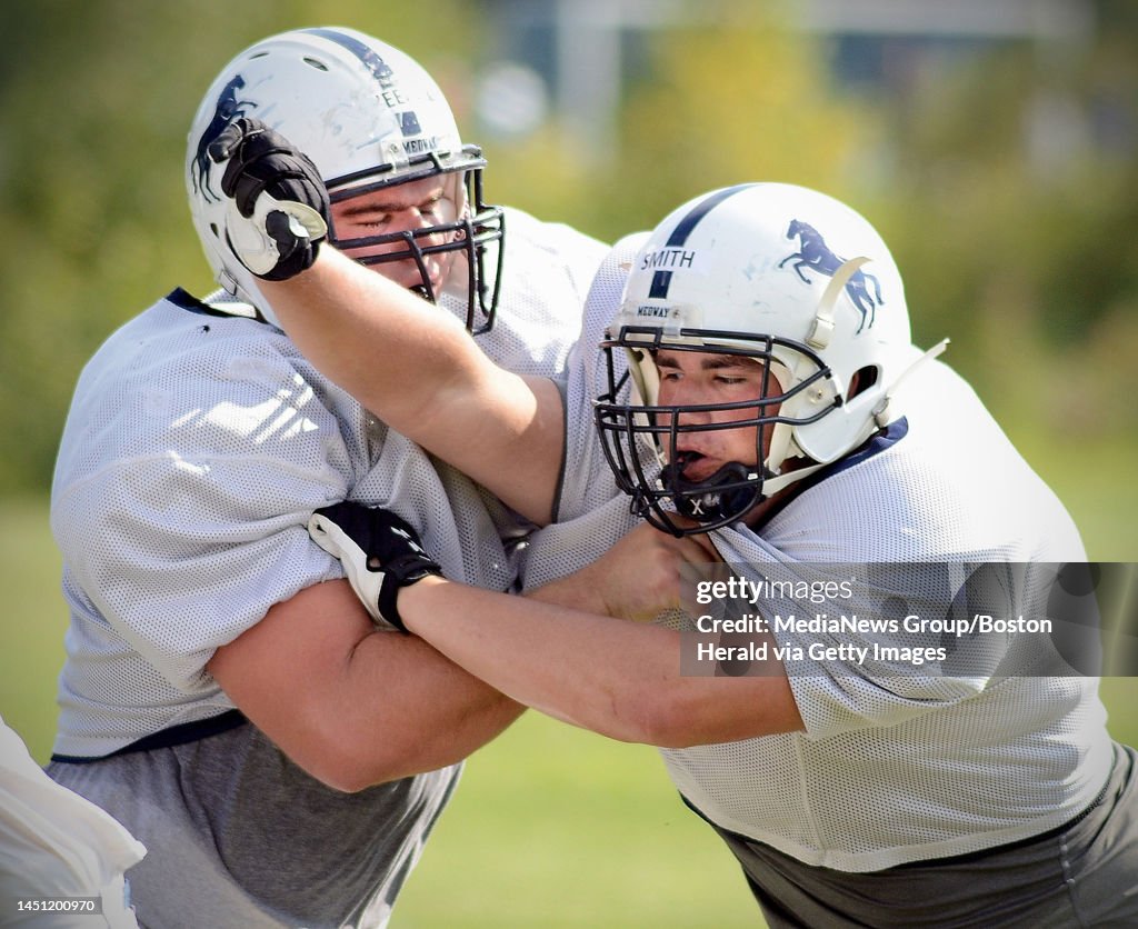 Medway High School football. Linemen Kevin Sheehan and Cam Smith