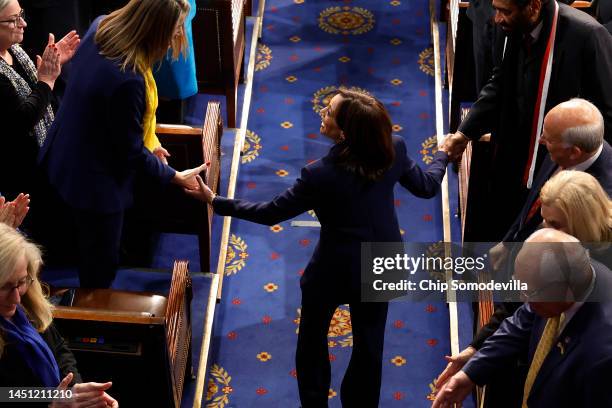 Vice President Kamala Harris greets lawmakers as she arrives in the House Chamber before an address by President of Ukraine Volodymyr Zelensky at the...