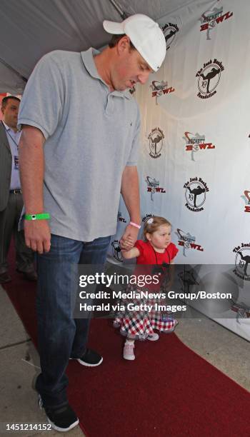 Boston, MA ? Avalanna Routh Roberts of Merrimac, a Jimmy Fund child battling Cancer, walks the red carpet with Red Sox pitcher John Lackey at the...