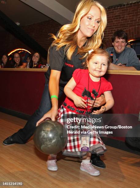 Boston, MA ? Avalanna Routh Roberts, 5 of Merrimac, a Jimmy Fund child battling Cancer, bowls with the help of NESN's Heidi Whatney at the Beckett...