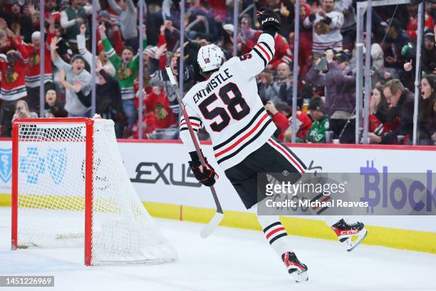 MacKenzie Entwistle of the Chicago Blackhawks celebrates after scoring a goal against the Nashville Predators during the second period at United...