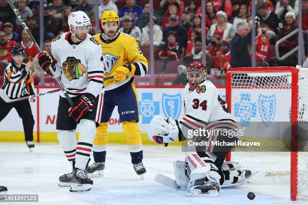 Petr Mrazek of the Chicago Blackhawks reacts after allowing a goal by Roman Josi of the Nashville Predators during the third period at United Center...