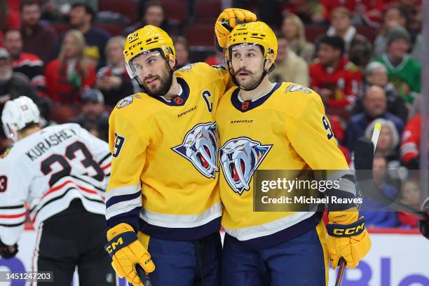 Roman Josi and Filip Forsberg of the Nashville Predators celebrate after scoring a goal against the Chicago Blackhawks during the third period at...