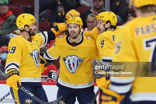 Thomas Novak of the Nashville Predators celebrates a goal against the Chicago Blackhawks during the third period at United Center on December 21,...