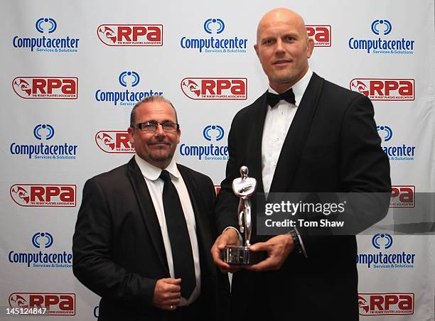 Paul Awcock the Aviva Head of HR and Will James the RPA Chairman pose with the Aviva Player Development Award for Ben Skirving of Bath Rugby during...