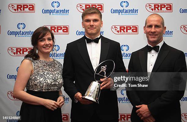 Claire Jeromson LV= Head of Sponsorship Owen Farrell of Saracens and Stuart Lancaster the England Coach pose with the LV= Young Player of the Year...