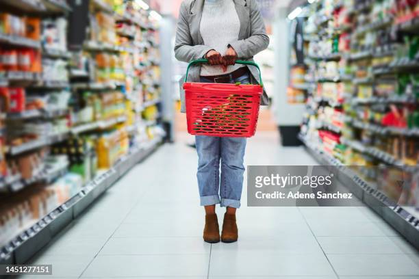 woman, grocery supermarket and basket in hands for food produce, retail and commercial goods. customer in supermarket, shopping in convenience store and buying products for special, discount or sale - convenience basket stock pictures, royalty-free photos & images
