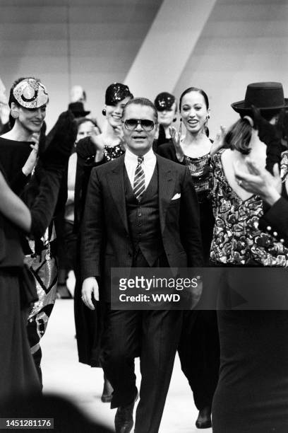 Designer Karl Lagerfeld with models Ines de la Fressange and Pat Cleveland